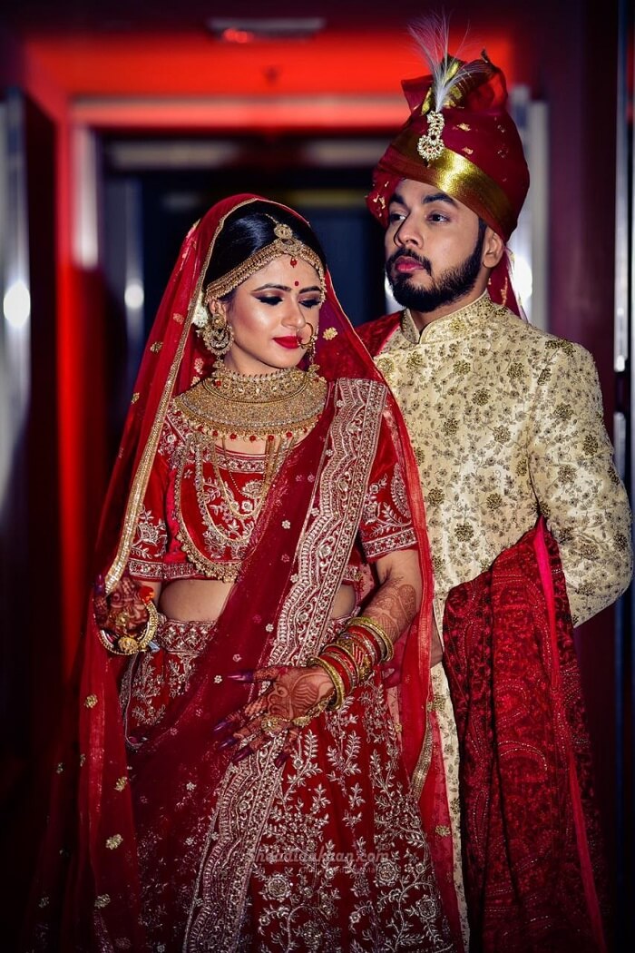 matching sherwani with red lehenga