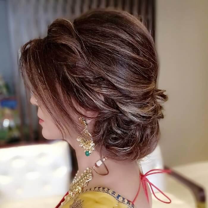 Slay the hair on your engagement pink rose lower bun loose strands Hair  Artistry By Archana… | Indian wedding hairstyles, Engagement hairstyles,  Bridal hair buns