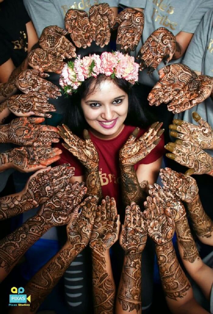 smiling-and-sitting-mehndi-poses-for-bride-2 | WedAbout